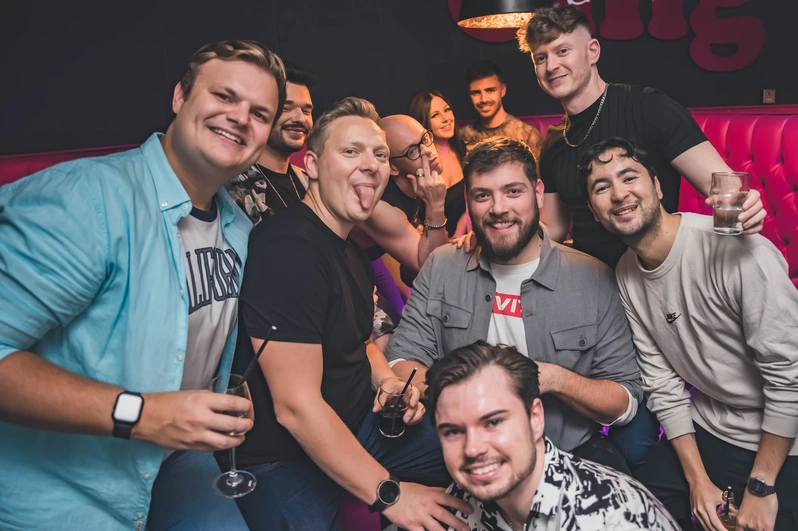 a group of clubbers make faces for a photo at OMG Bristol Bar