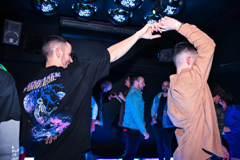 Two men dancing at OMG Bristol Bar