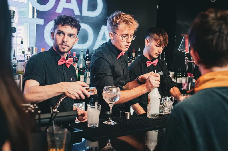 Three barmen mixing drinks at OMG Liverpool